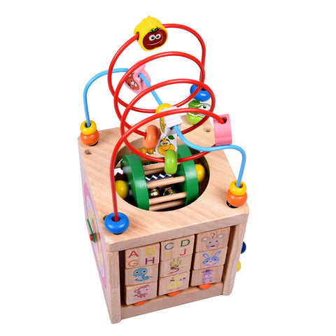 Image of Wooden children's puzzle beetle surrounded by large beads